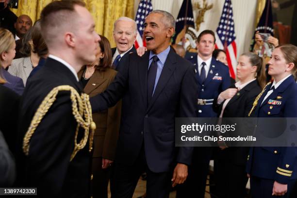 Former President Barack Obama and President Joe Biden greet friends and guests at the conclusions of an event to mark the 2010 passage of the...