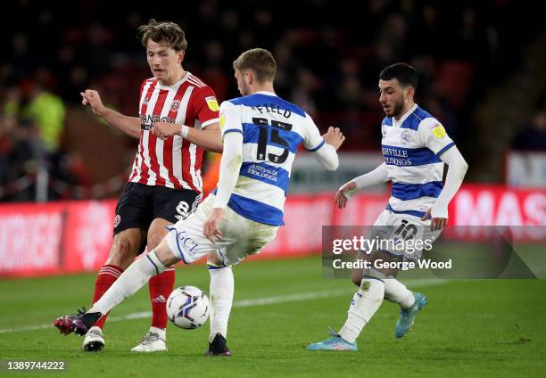 Sander Berge of Sheffield United is challenged by Sam Field of Queens Park Rangers during the Sky Bet Championship match between Sheffield United and...