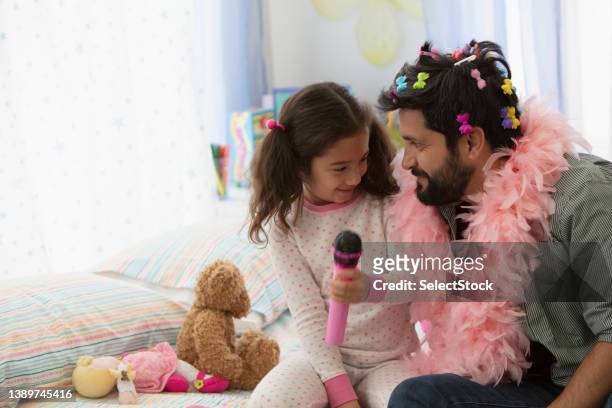 father and daughter having fun dressing up - time life rock stars and family stock pictures, royalty-free photos & images