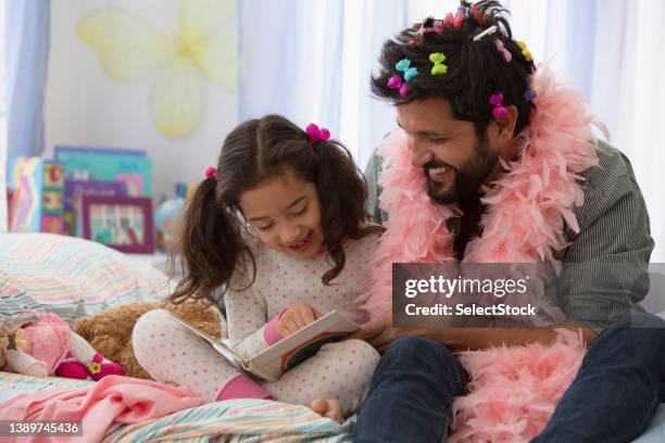 father and daughter having fun dressing up - family time stock pictures, royalty-free photos & images