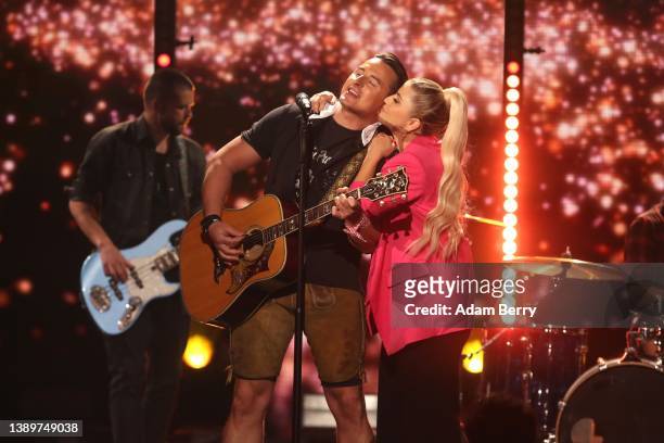 Beatrice Egli and Andreas Gabalier are seen on stage during the tv show "Die Beatrice Egli-Show" at Studio Berlin Adlershof on April 05, 2022 in...
