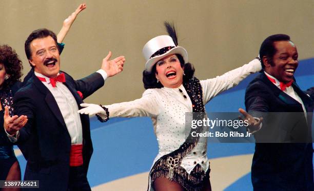 Ann Miller dances with Robert Goulet and Lou Rawls during 'Hollywood 100th Birthday' celebration, April 26, 1987 in Hollywood section of Los Angeles,...