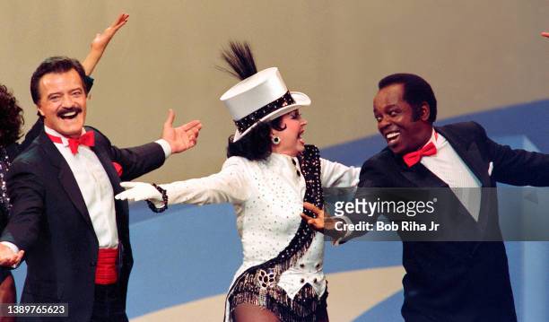 Ann Miller dances with Robert Goulet and Lou Rawls during 'Hollywood 100th Birthday' celebration, April 26, 1987 in Hollywood section of Los Angeles,...