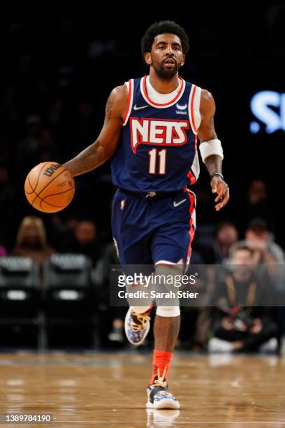 Kyrie Irving of the Brooklyn Nets dribbles during the first half against the Houston Rockets at Barclays Center on April 05, 2022 in the Brooklyn...