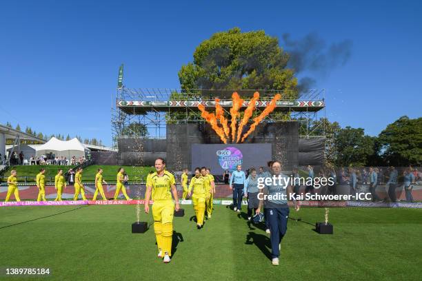 Captains Meg Lanning of Australia and Heather Knight of England lead their teams onto the field ahead of the 2022 ICC Women's Cricket World Cup Final...