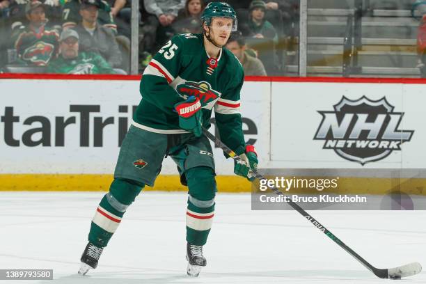 Jonas Brodin of the Minnesota Wild skates with the puck against the Philadelphia Flyers during the game at the Xcel Energy Center on March 29, 2022...