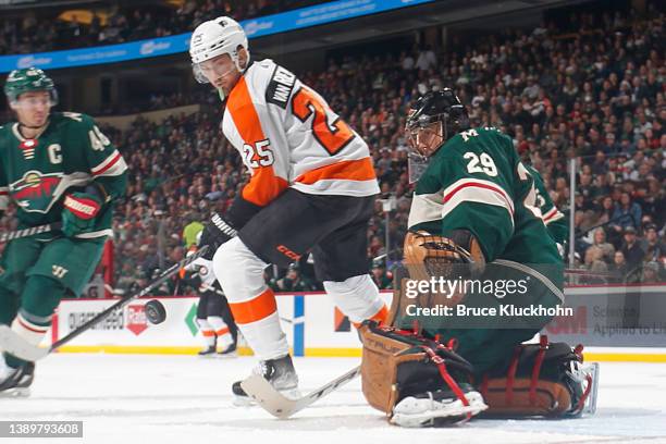 Marc-Andre Fleury of the Minnesota Wild defends his goal against James van Riemsdyk of the Philadelphia Flyers during the game at the Xcel Energy...