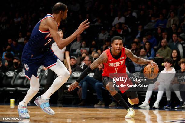 Kevin Porter Jr. #3 of the Houston Rockets dribbles as Kevin Durant of the Brooklyn Nets defends during the second half at Barclays Center on April...