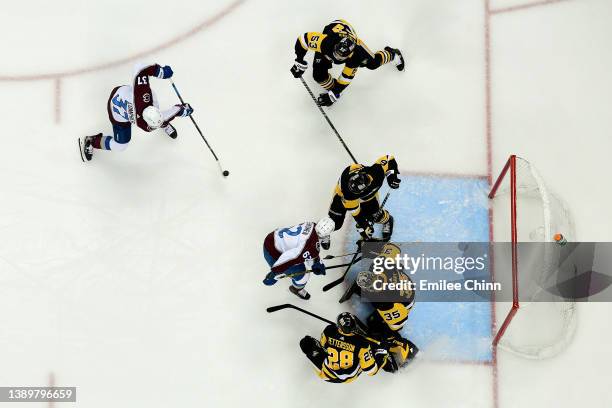 Compher of the Colorado Avalanche shoots and scores a goal during the second period against the Pittsburgh Penguins at PPG PAINTS Arena on April 05,...