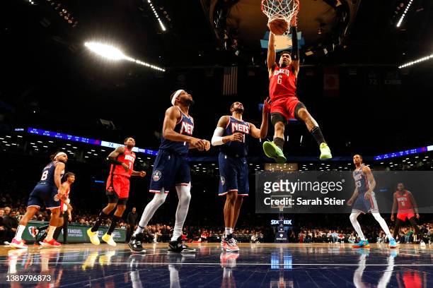 Kenyon Martin Jr. #6 of the Houston Rockets dunks as LaMarcus Aldridge and Bruce Brown of the Brooklyn Nets defend during the game at Barclays Center...