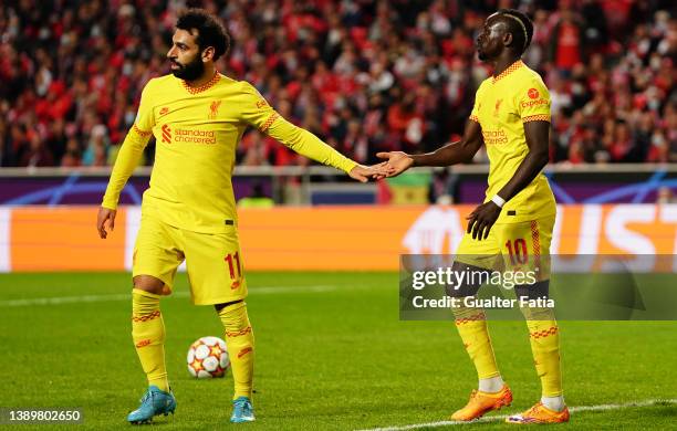 Sadio Mane of Liverpool FC celebrates with teammate Mohamed Salah of Liverpool FC after scoring a goal during the Quarter Final Leg One - UEFA...