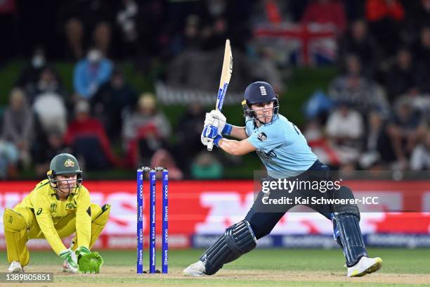 Alyssa Healy of Australia looks on as Natalie Sciver of England looks to bat during the 2022 ICC Women's Cricket World Cup Final match between...