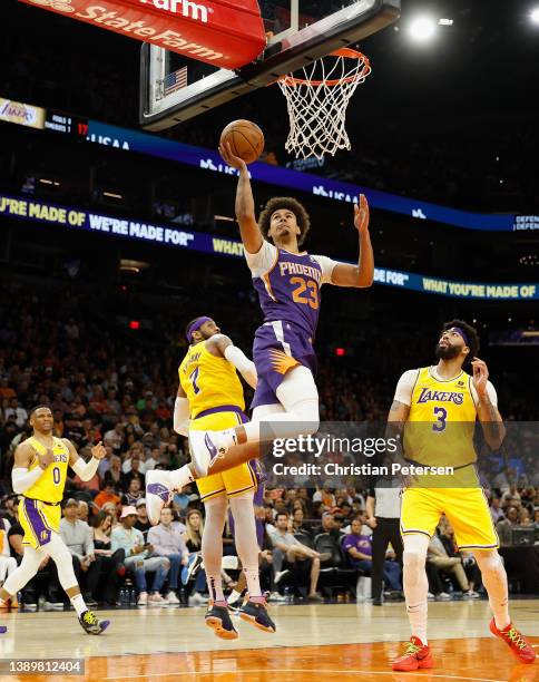 Cameron Johnson of the Phoenix Suns puts up a shot past Carmelo Anthony, Russell Westbrook and Anthony Davis of the Los Angeles Lakers during the...