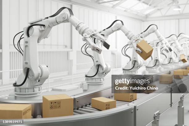 robot arm and cardboard box - robotarm robot stockfoto's en -beelden