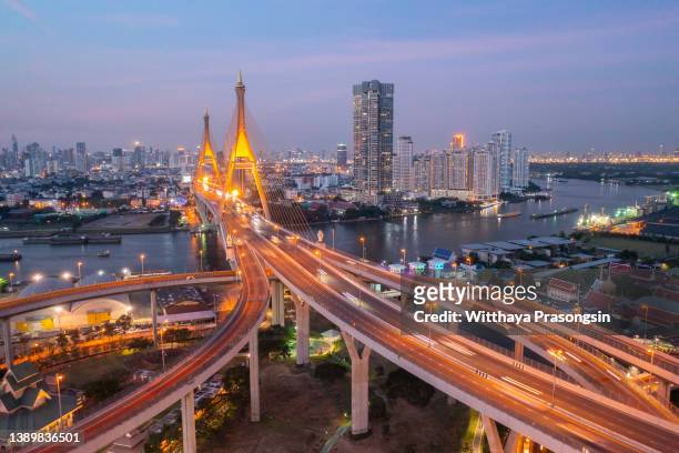 bridge in bangkok and container cargo freight ship - national stock pictures, royalty-free photos & images