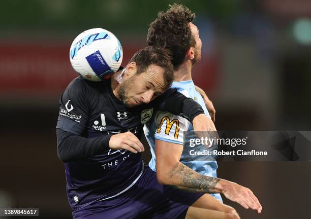 Adam Le Fondre of Sydney FC is challenged by Aiden O'Neill of Melbourne City during the A-League Mens match between Melbourne City and Sydney FC at...