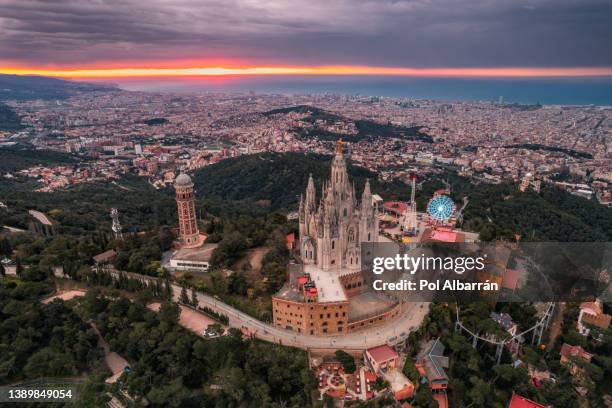aerial view of barcelona skyline with sagrat cor temple during sunrise, catalonia, spain - tibidabo fotografías e imágenes de stock