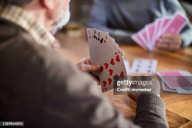 playing cards! - senior men playing cards stock pictures, royalty-free photos & images