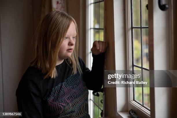 portrait of young lady with down syndrome - 16 17 girl blond hair stock pictures, royalty-free photos & images