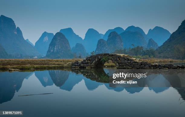 a stone bridge in guilin,china - xingping stock pictures, royalty-free photos & images