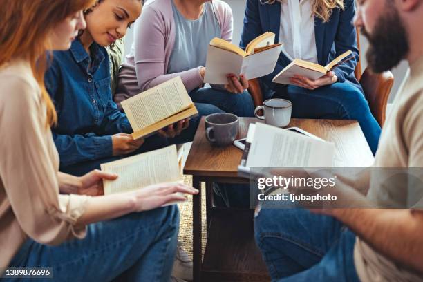 enjoying reading and learning in library. - book club meeting stockfoto's en -beelden