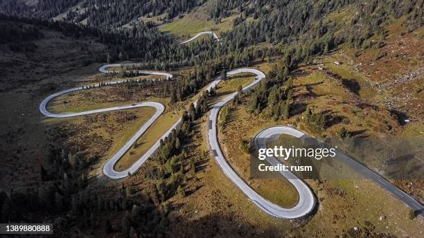 overhead aerial view of nockalm road in carinthia, austria. - mountain pass stock pictures, royalty-free photos & images