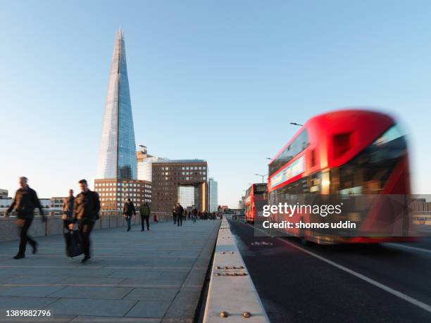 city workers against london skyline at dusk - rush hour stock pictures, royalty-free photos & images
