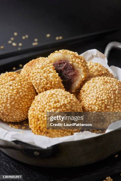 chinese sesame balls with red bean paste - sesame balls stock pictures, royalty-free photos & images