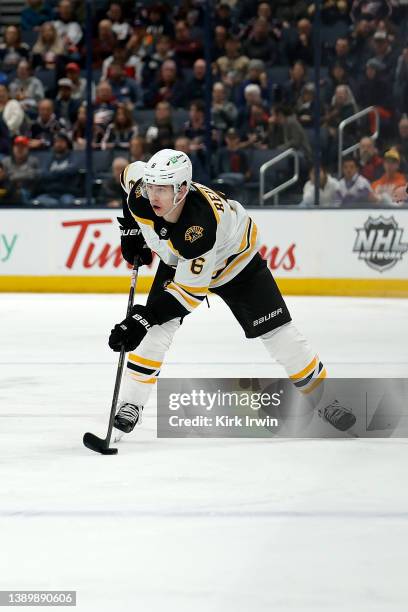 Mike Reilly of the Boston Bruins controls the puck during the game against the Columbus Blue Jackets at Nationwide Arena on April 4, 2022 in...