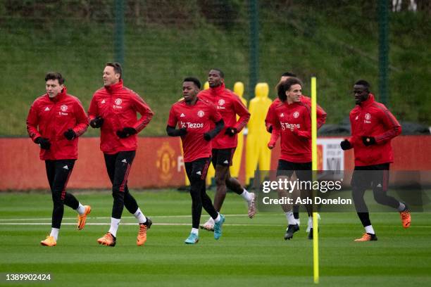 Victor Lindelof, Nemanja Matic, Anthony Elanga, Paul Pogba, Hannibal Mejbri, Eric Bailly of Manchester United in action during a first team training...