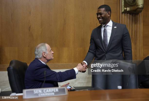 Environmental Protection Agency Administrator Michael Regan greets Chairman Sen. Tom Carper as he arrives to testify before the Senate Environment...