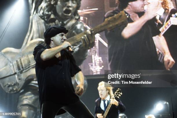 Brian Johnson and Angus Young of AC/DC perform at San Jose Arena on September 19, 2000 in San Jose, California.