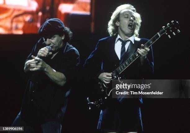 Brian Johnson and Angus Young of AC/DC perform at San Jose Arena on September 19, 2000 in San Jose, California.