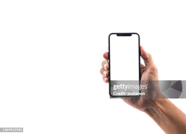 close up of man hand holding smartphone on white background, cropped hand using smartphone on the background white - stock photo - photograph mockup stock pictures, royalty-free photos & images