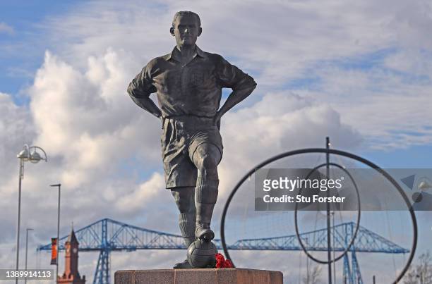 The statue of former Boro player George Hardwick stands outside the stadium as the Transporter Bridge and Temenos Sculpture are seen in the...