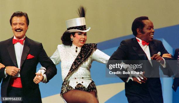 Ann Miller performs with Robert Goulet and Lou Rawls during 'Hollywood 100th Birthday' celebration, April 26, 1987 in Hollywood section of Los...