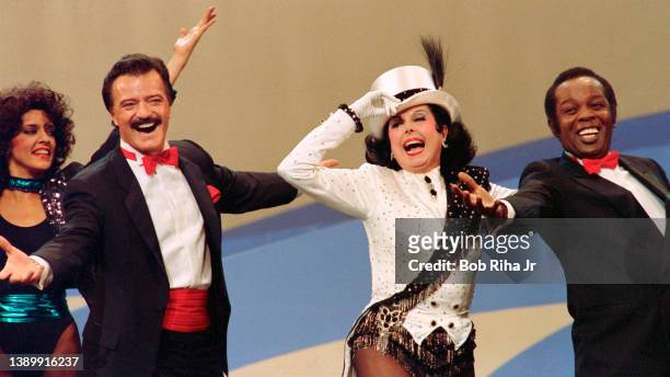 Ann Miller performs with Robert Goulet and Lou Rawls during 'Hollywood 100th Birthday' celebration, April 26, 1987 in Hollywood section of Los...