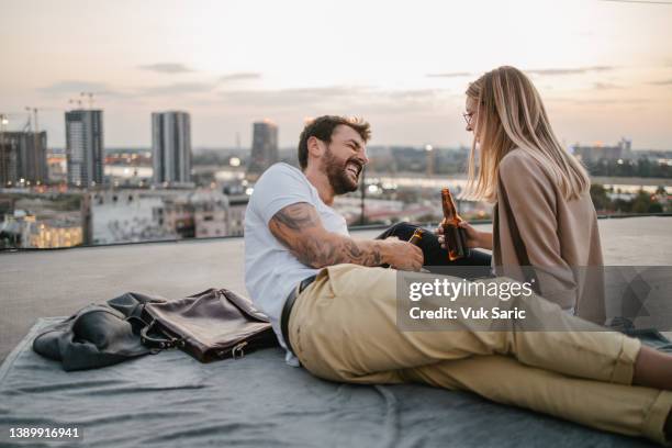 drinking beer on a rooftop - belgrade skyline imagens e fotografias de stock