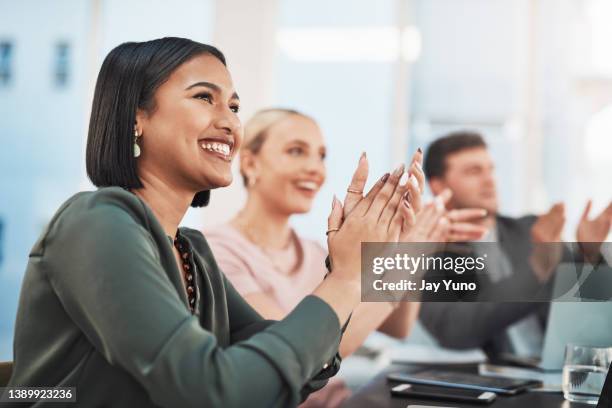 shot of a group of businesspeople clapping during a meeting in a modern office - business people cheering stockfoto's en -beelden