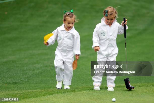 Daughters of Paul Casey of England and Sergio Garcia of Spain, Astaria Casey and Azalea Garcia during the Par Three Contest prior to the Masters at...