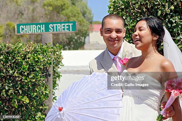 Sumaiyau Freeman and Brett Syster, one of the ten couples who tied the knot during the 12th annual mass Valentine's Day wedding ceremony, smile at...