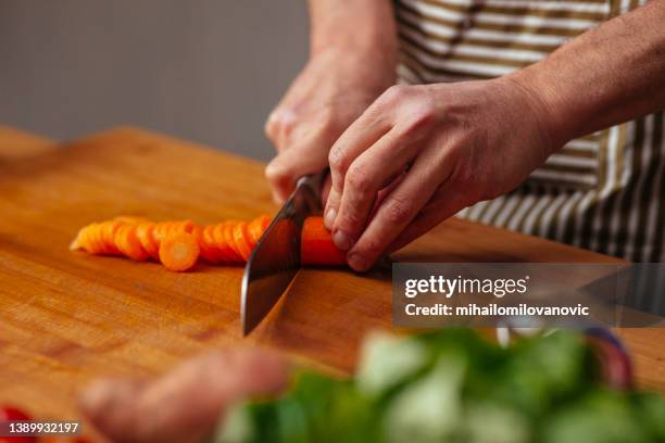 slicing carrot - chopping food stock pictures, royalty-free photos & images