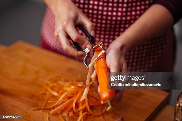 peeling carrot - peeler stock pictures, royalty-free photos & images