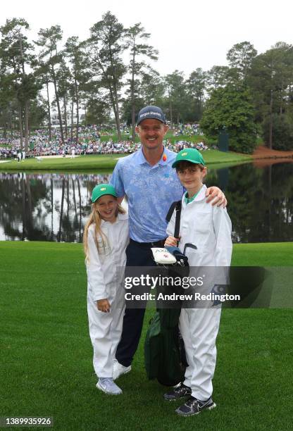 Justin Rose of England and children Leo Rose and Charlotte Rose during the Par Three Contest prior to the Masters at Augusta National Golf Club on...