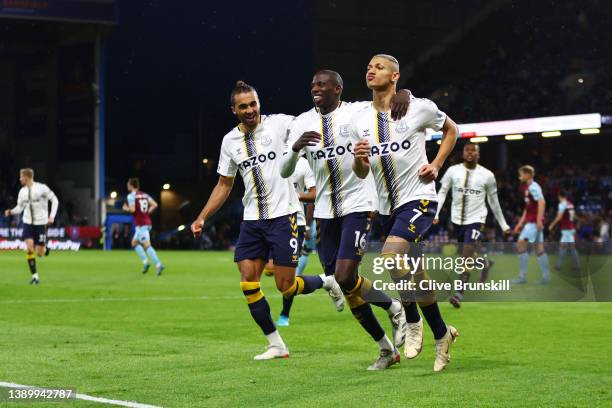 Richarlison of Everton celebrates with teammates Dominic Calvert-Lewin and Abdoulaye Doucoure after scoring their team's second goal from the penalty...