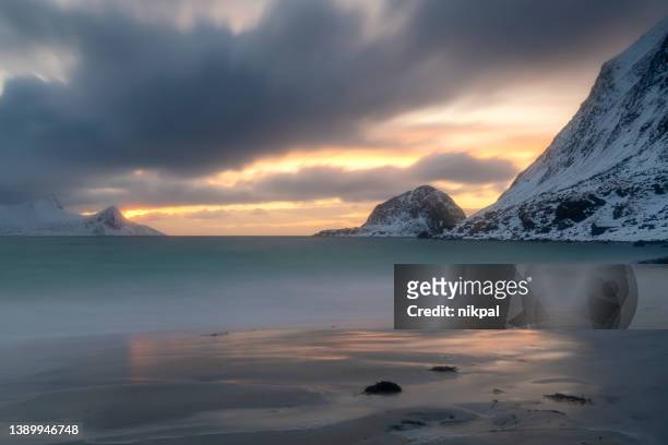 haukland beach in winter at sunset- lofoten islands - norway - dramatic sky stock pictures, royalty-free photos & images
