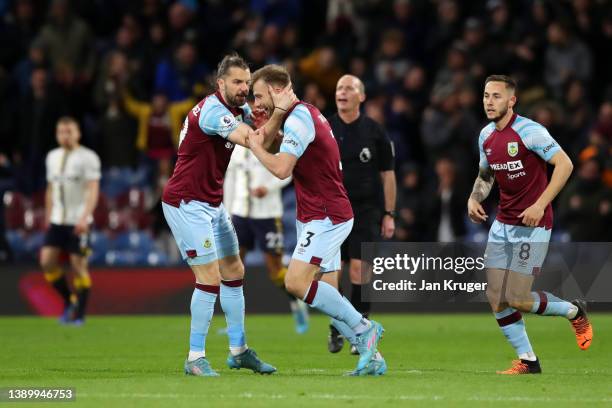 Jay Rodriguez of Burnley celebrates with teammate Charlie Taylor after scoring their team's second goal during the Premier League match between...