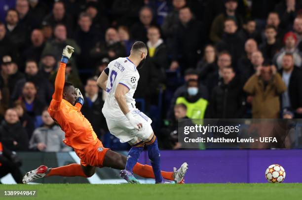 Karim Benzema of Real Madrid scores their team's third goal and their hat trick past Edouard Mendy of Chelsea during the UEFA Champions League...