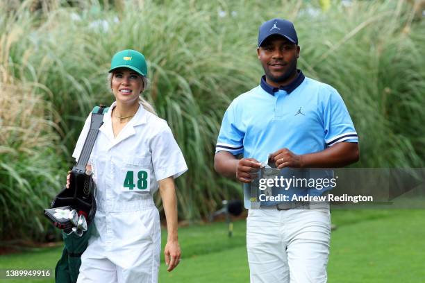 Harold Varner III of the United States and Amanda Singleton during the Par Three Contest prior to the Masters at Augusta National Golf Club on April...