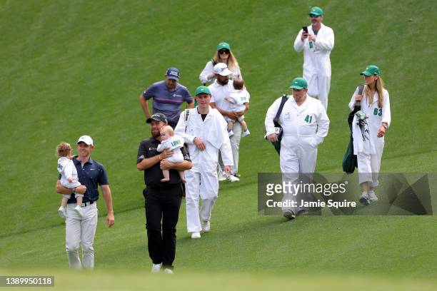 Rory McIlroy of Northern Ireland, Shane Lowry of Ireland, Padraig Harrington of Ireland and participants during the Par Three Contest prior to the...